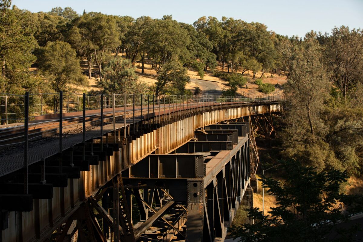 Historic railroad trestle spanning downtown Auburn, California, at sunset