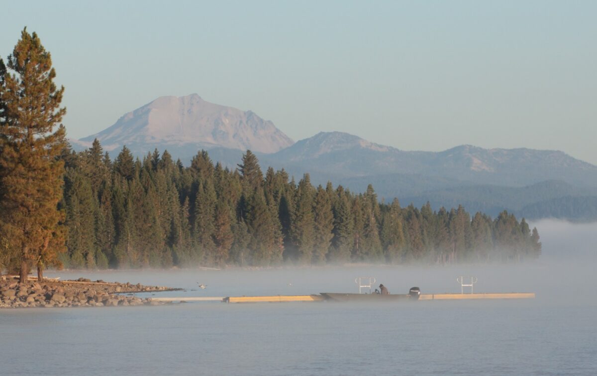 Early morning view across Lake Almanor toward distant mountains