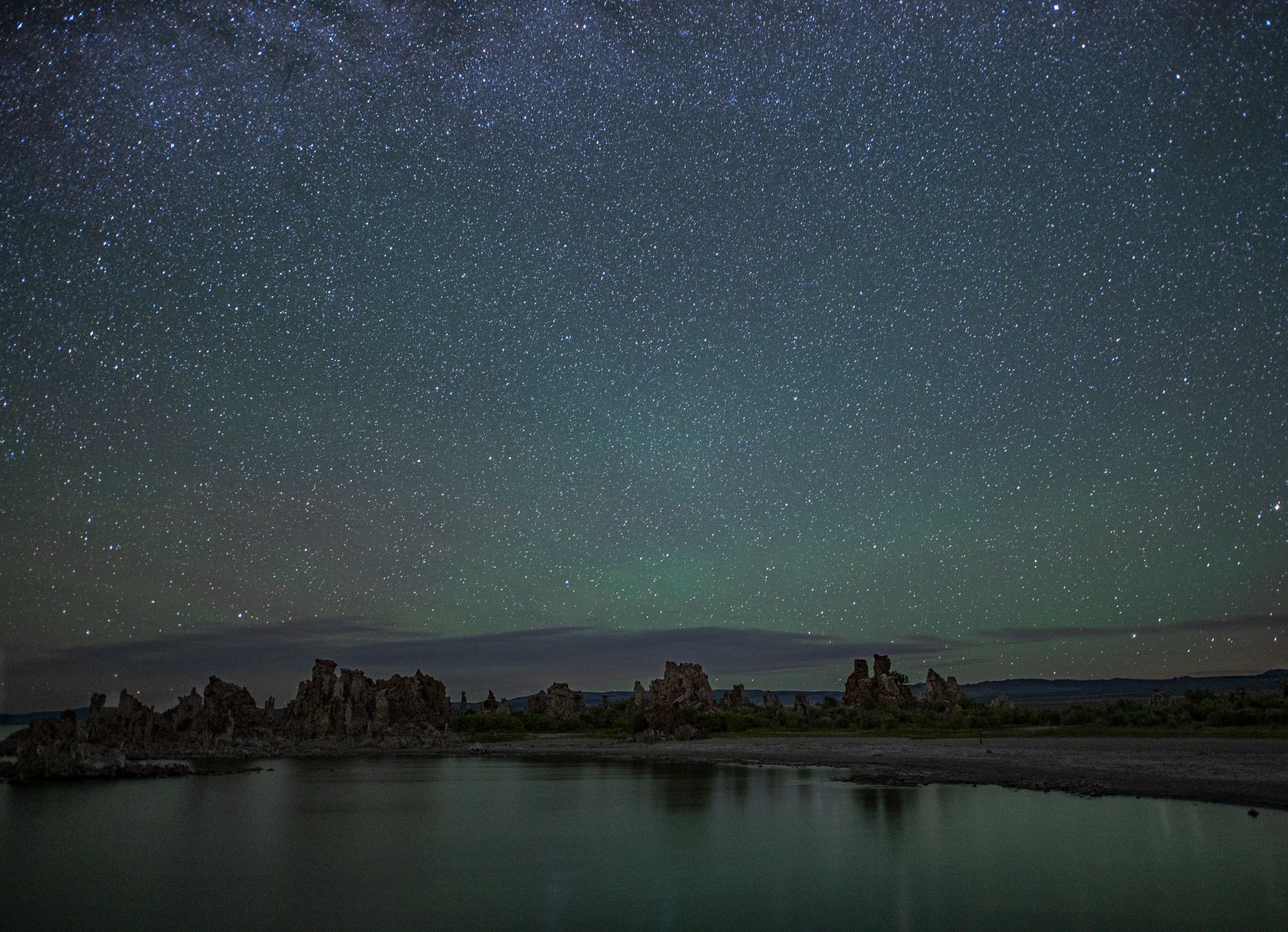 Tufa formations at Mono Lake beneath a starry night sky