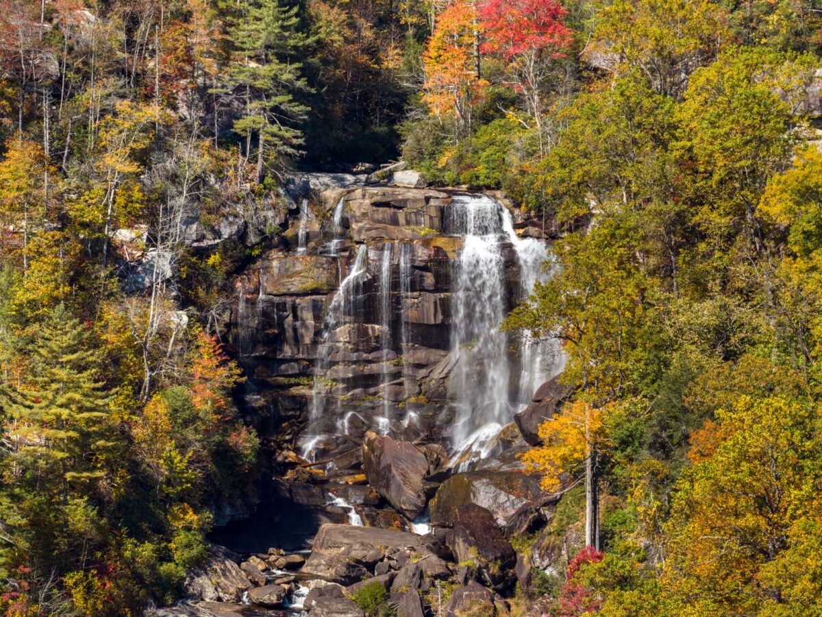 Whitewater Falls surrounded by colorful autumn foliage in Nantahala National Forest, North Carolina